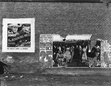 Show poster in Alabama town, 1936. Creator: Walker Evans.
