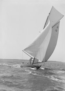 The 8 Metre yacht 'Antwerpia' (H19) sailing with spinnaker, 1911. Creator: Kirk & Sons of Cowes.