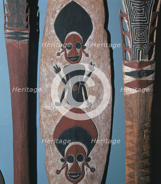 Detail of figures carved and painted on a ceremonial canoe paddle from the Solomon Islands. Artist: Unknown