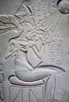 Akhenaten holding one of his daughters. Artist: Unknown