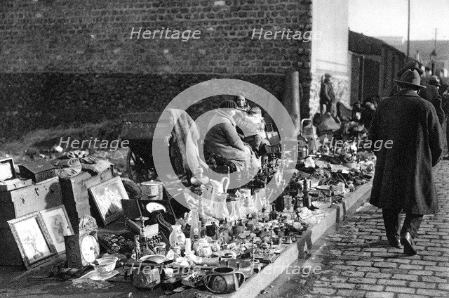A display of goods at the flea market, Paris, 1931. Artist: Ernest Flammarion