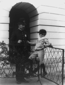 Archie Roosevelt and his friend the policeman, c1902. Creator: Frances Benjamin Johnston.