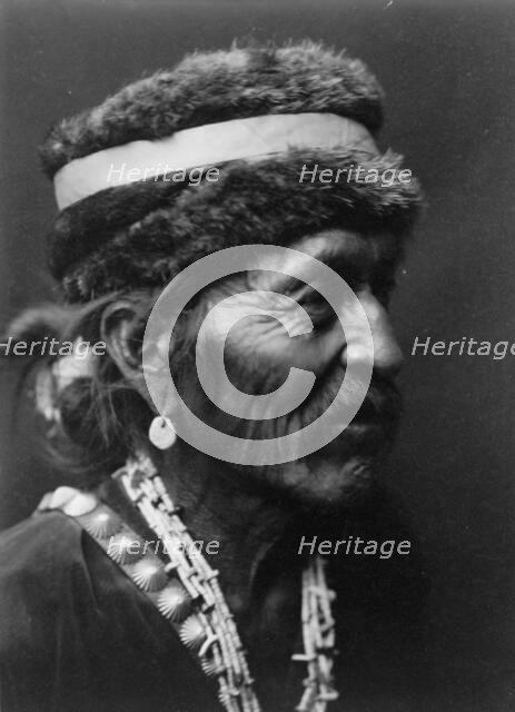 Navajo with fur cap, c1905. Creator: Edward Sheriff Curtis.
