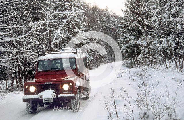 2001 Land Rover Defender driving in snowy conditions. Creator: Unknown.