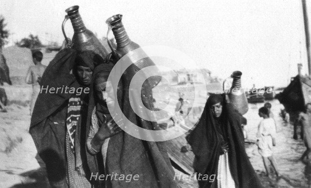 Female water carriers, Amarah, Iraq, 1917-1919. Artist: Unknown
