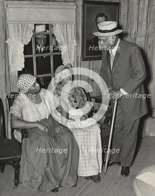 Man looking in window, 1935 - 1939. Creator: Unknown.