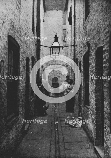 'Photograph of a sunless Court in Liverpool recently closed by the Health Committee of the City Coun Artist: Unknown.