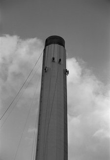 Workers painting an industrial chimney, Hackney, London, 1965. Artist: Laurence Goldman.