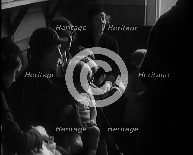 Female Civilians and Their Babies at Health Clinics Where the Babies Are Checked by Female..., 1931. Creator: British Pathe Ltd.