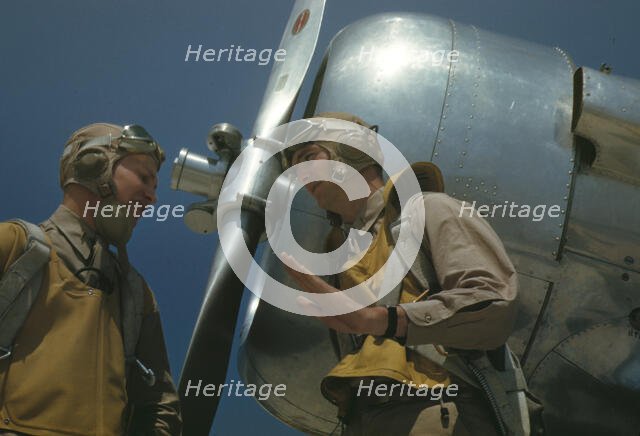 Marine lieutenants, pilots, by the power tow-plane for the...Page Field, Parris Island, S.C., 1942. Creator: Alfred T Palmer.