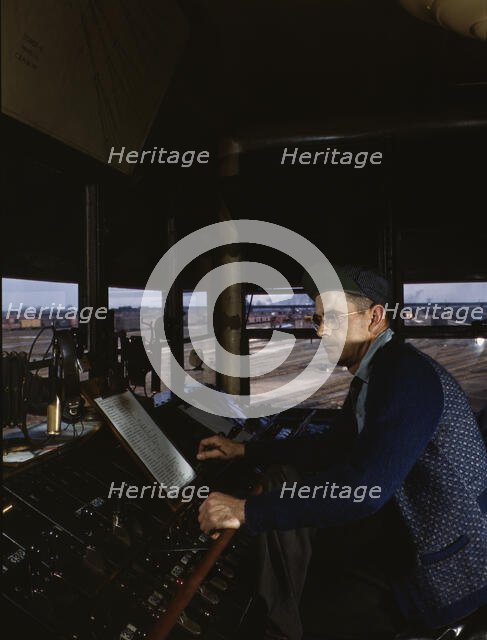 C&NWRR towerman R.W. Mayberry of Elmhurst, Ill., at the Proviso yard, Melrose Park, Ill., 1943. Creator: Jack Delano.
