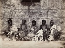 Famine in Mysore, India: six emaciated women, five sitting and one leaning on another's lap, 1876-78 Creator: Willoughby Wallace Hooper.