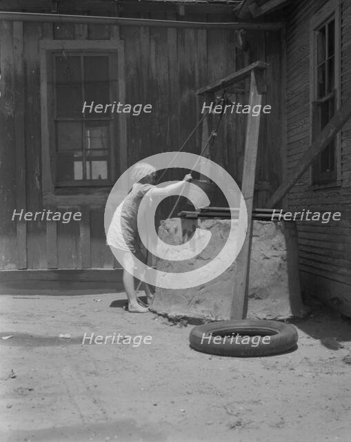 One of a Texas sharecropper's ten children, Hall County, Texas, 1937. Creator: Dorothea Lange.