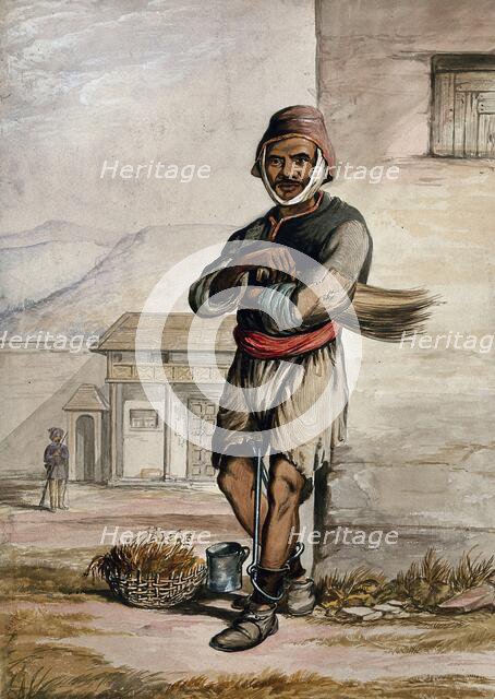 A man of Simla, standing in a prison with manacles around his ankles, 1866. Creator: R Clint.