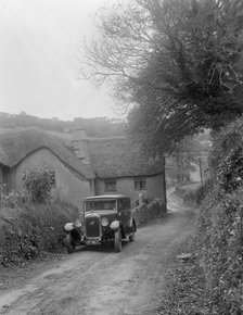 1931 Austin 16/6 on a road test, parked outside Parliament Cottage, Stoke Gabriel, Devon. Artist: Bill Brunell.