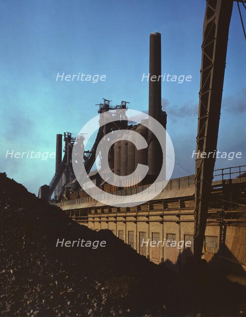 Blast furnaces and iron ore at the Carnegie-Illinois Steel Corporation mills, Etna, Pennsylvania, 19 Creator: Alfred T Palmer.