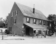 McDuff Green Warehouse in Falmouth, Stafford County, Virginia--H.G. Lightner store, c1927 - 1943. Creator: Frances Benjamin Johnston.