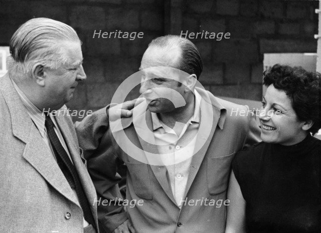 Alfred Neubauer with Juan Manuel Fangio and his wife, c1954-c1955. Artist: Unknown