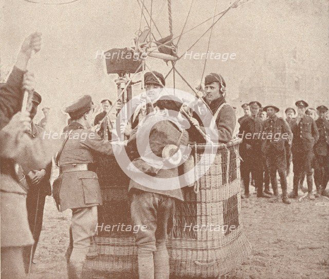Canadian official cinematographer and assistant ready to ascend in a kite balloon, c1917 (1919). Artist: Unknown.