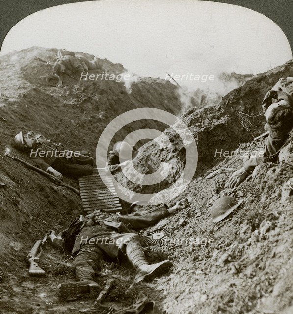 Soldiers of the 5th Army killed during the German offensive of 1918, Albert, France.Artist: Realistic Travels Publishers