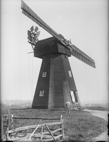 Exterior of the Old Mill, Northbourne, Kent with the miller, Mr J Court, stood outside, 1933. Creator: HES Simmons.
