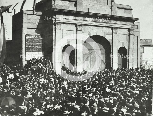 Crowd outside the closed East India Dock Gates, Poplar, London, 1897. Artist: Unknown.