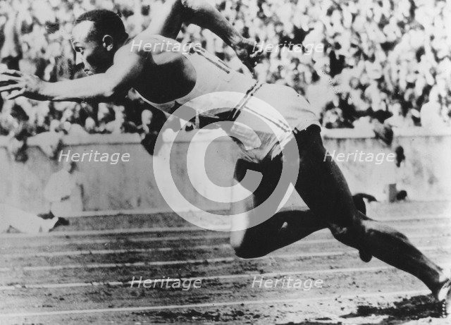 Jesse Owens, American athlete, competing in the Olympics in Berlin, Germany, 1936. Artist: Unknown