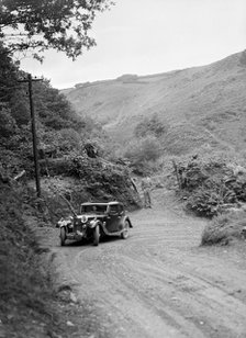 1934 Riley Falcon saloon taking part in a motoring trial in Devon, late 1930s. Artist: Bill Brunell.