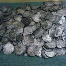 Coins, mainly Byzantine and Islamic - part of Viking treasure found in burials which illustrate theextent of Viking travels.