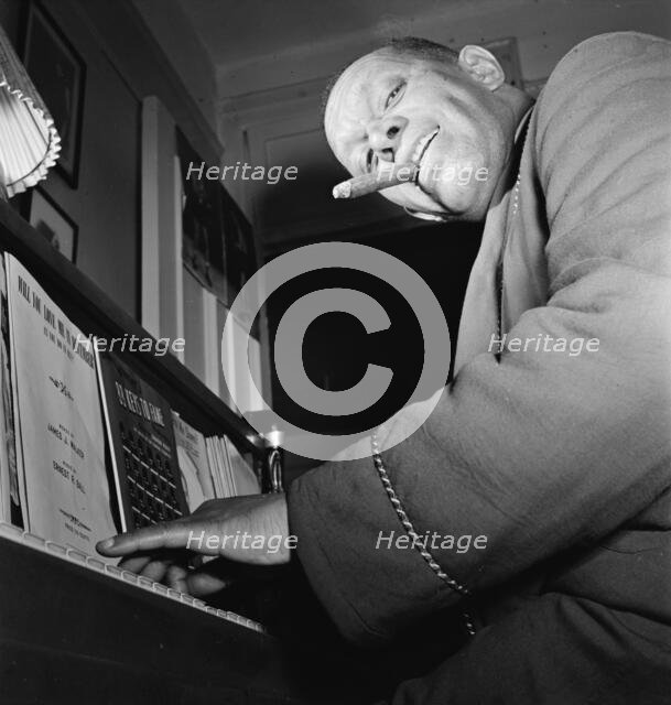 Portrait of Willie Smith in his apartment, Manhattan, New York, N.Y., ca. Jan. 1947. Creator: William Paul Gottlieb.