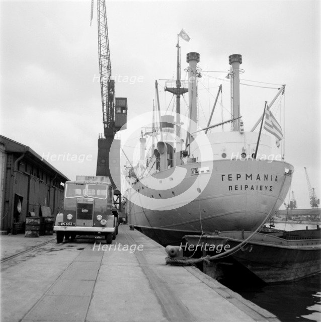 A ship unloading in West India Docks, London, c1945-c1965. Artist: SW Rawlings