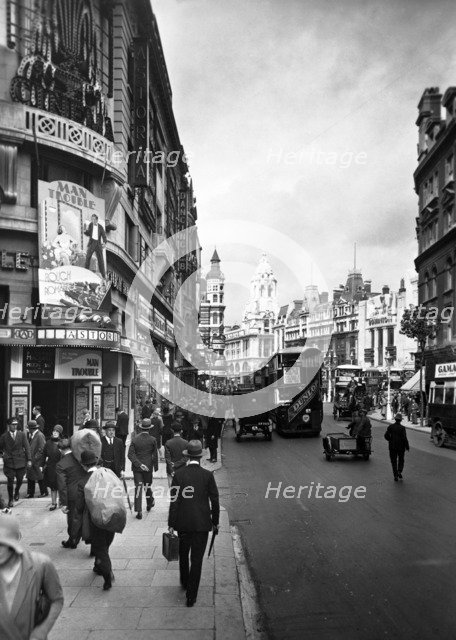 People walking past the Astoria Theatre in Charing Cross Road, Westminster, London, early 1930s.   Artist: George Davison Reid