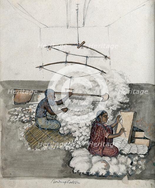 A man and a woman making cotton, (between 1800 and 1899?). Creator: Unknown.