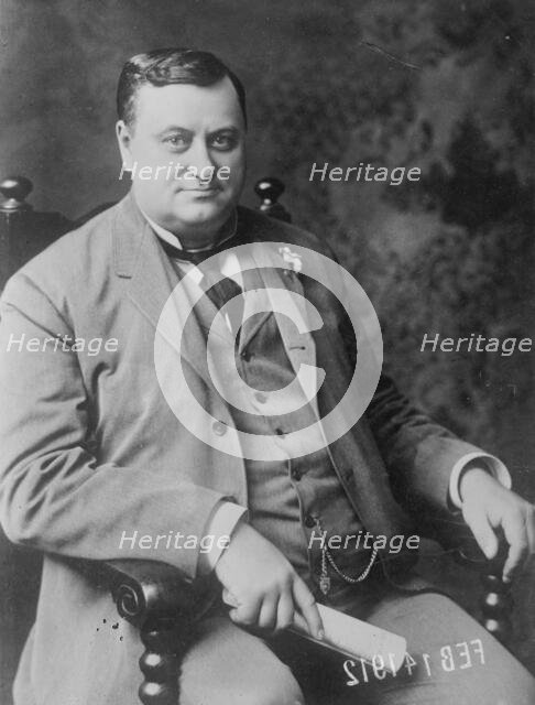 Chas. E. Piper, seated, 1912. Creator: Bain News Service.