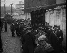 Marchers Carrying a Banner Which Reads: 'Miners March to London', 1931. Creator: British Pathe Ltd.