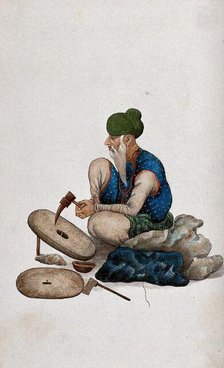 A man making grindstones, (between 1800 and 1899?). Creator: Unknown.