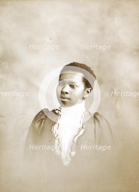 Studio portrait of young woman, c1890-c1899. Creators: M Yogg, Unknown.
