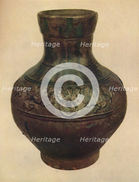 'Wine Jar with Hunting Scene in Relief. Han Dynasty, 206 BC - AD 221, (1927). Artists: Edward F Strange, Unknown.