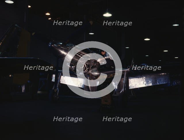 P-51 ("Mustang") fighter plane in construction, North American Aviation, Inc., LA, Calif. , (1942?). Creator: Alfred T Palmer.