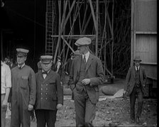 American Airship Crew Members Standing Outside the Hangar of an R 38 Airship in the United..., 1921. Creator: British Pathe Ltd.