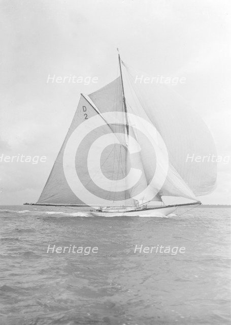 The 15 Metre cutter 'Ostara' broad reaching, 1912. Creator: Kirk & Sons of Cowes.