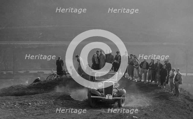 Singer saloon of Michael McEvoy competing in the Sunbac Inter-Club Team Trial, 1935. Artist: Bill Brunell.