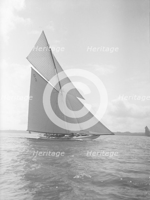 The 15-metre cutter 'Ostara' sailing close-hauled, 1911. Creator: Kirk & Sons of Cowes.