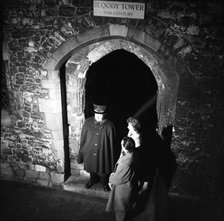 Yeoman Warder and visitors at the Bloody Tower, Tower of London, c1955. Creator: Arthur Charles Kirby Ware.
