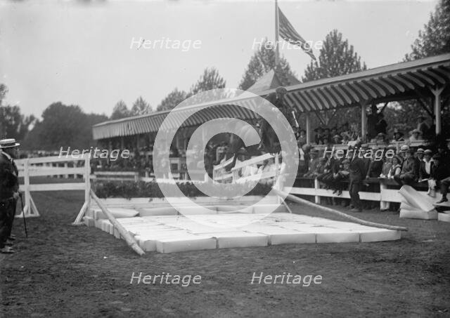 Horse Shows - Ralph Coffin; Broad Jump, 1917. Creator: Harris & Ewing.