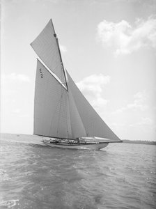 The early 12 Metre cutter 'Cintra' sailing close-hauled, 1911. Creator: Kirk & Sons of Cowes.