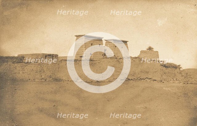 Vue des Pylones du Temple Khons et d'une partie du village de Karnac, 1849-50. Creator: Maxime du Camp.