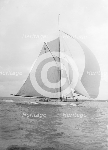 'Istria' sailing downwind under spinnaker, 1912.  Creator: Kirk & Sons of Cowes.