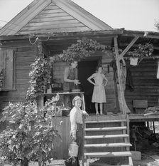 Hop farmer's children, small owner, and backyard..., near Independence, Polk County, Oregon, 1939. Creator: Dorothea Lange.