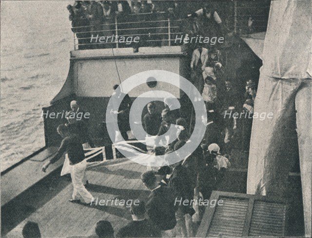 'Bringing the Body on Deck', c1900, (1910). Artist: Unknown.